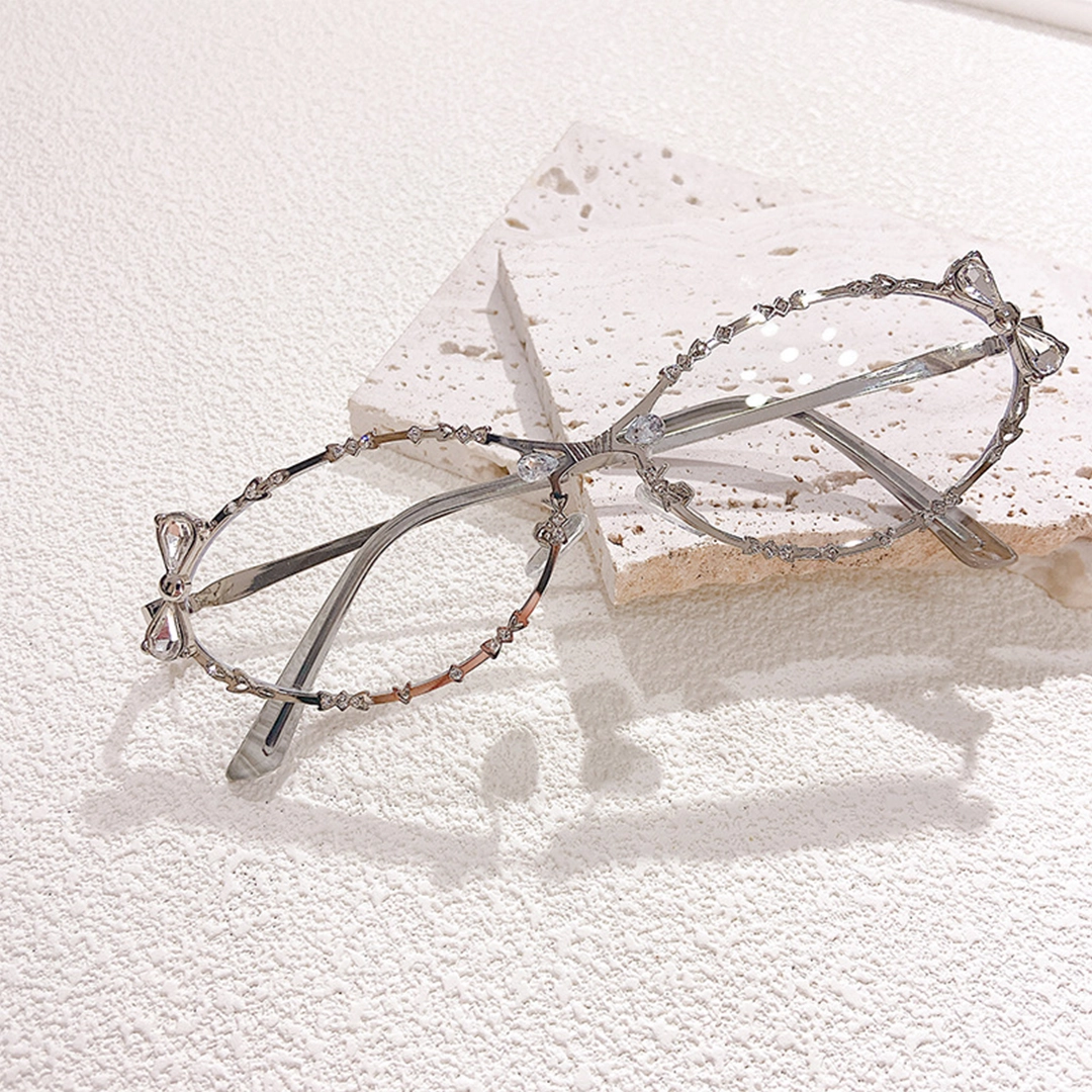 Scene view of Nox y2k oval metal eyeglasses OM0292512 in silver