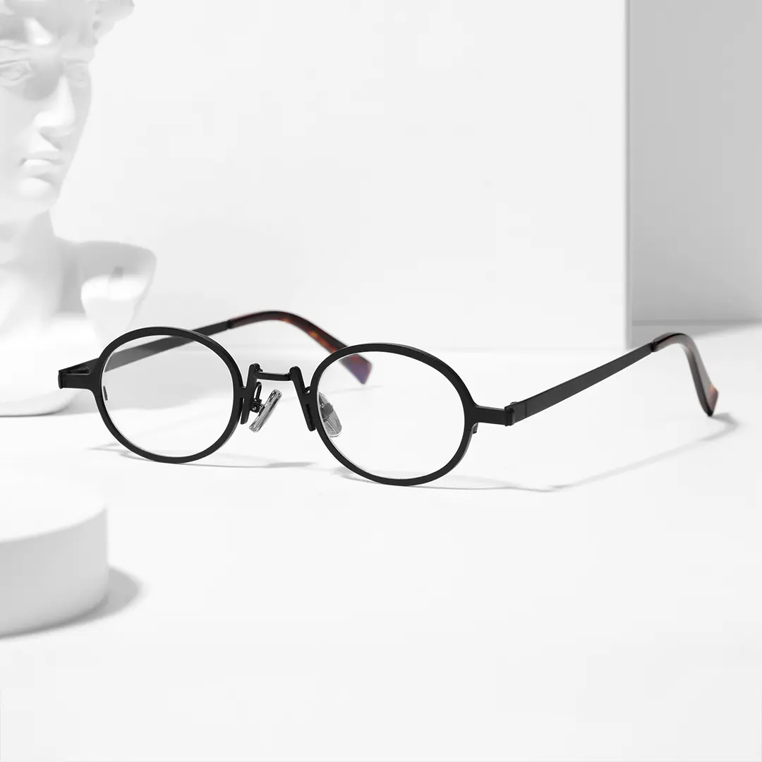 Scene view of Tonny oval metal eyeglasses OM0592302 in black
