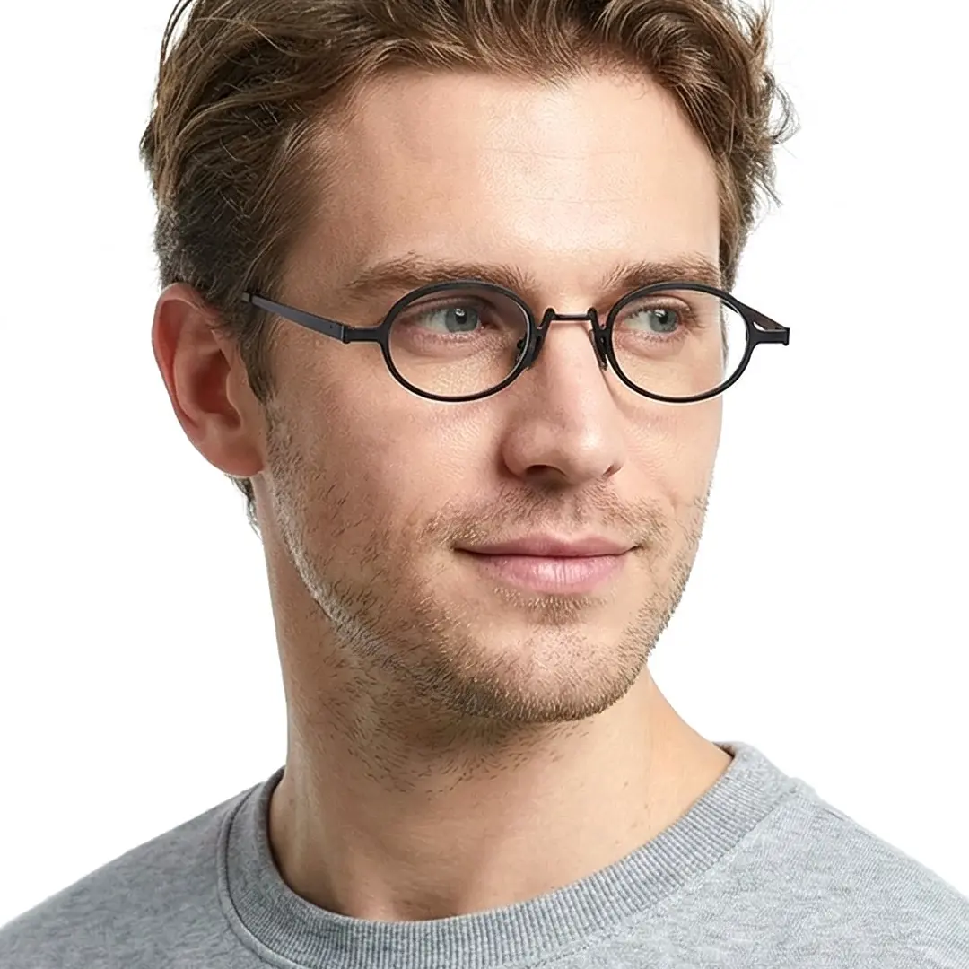 Three-quarter view of male wearing vintage black oval eyeglasses, natural smile, OM0592302