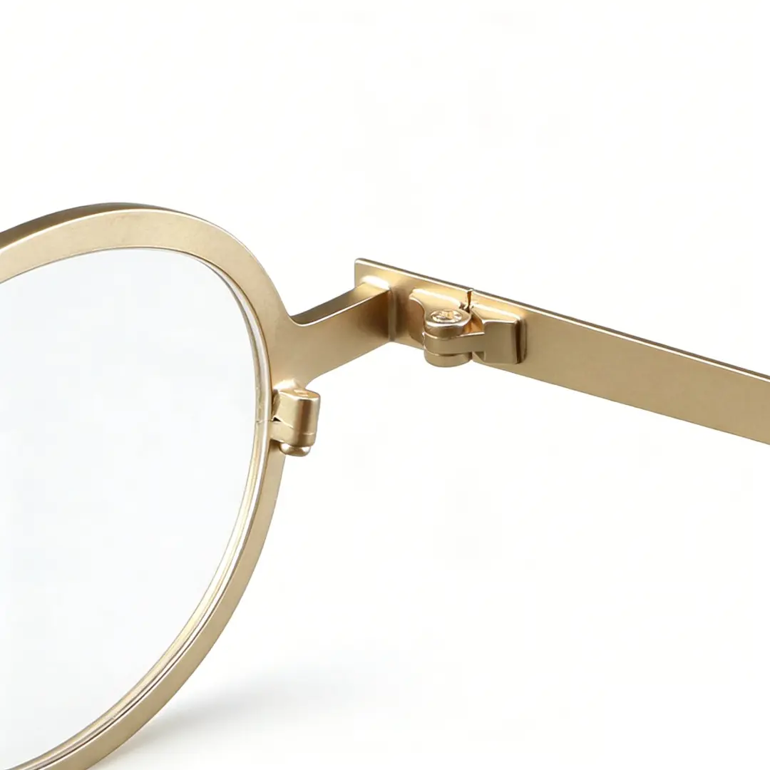 Spring hinge detail of Tonny oval metal eyeglasses OM0592302 in gold