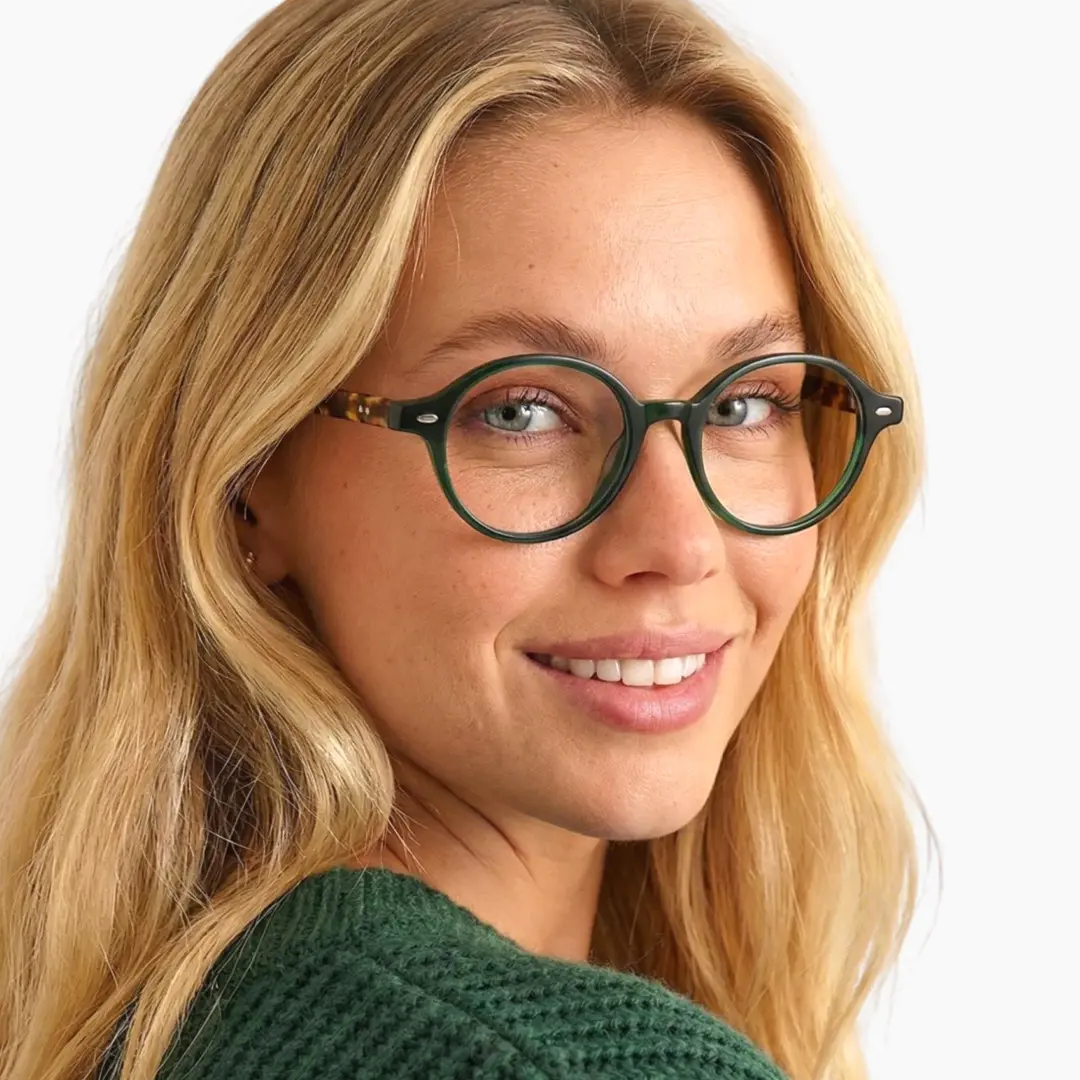 Over-the-shoulder view of female wearing vintage green oval eyeglasses, smiling, OR0082406
