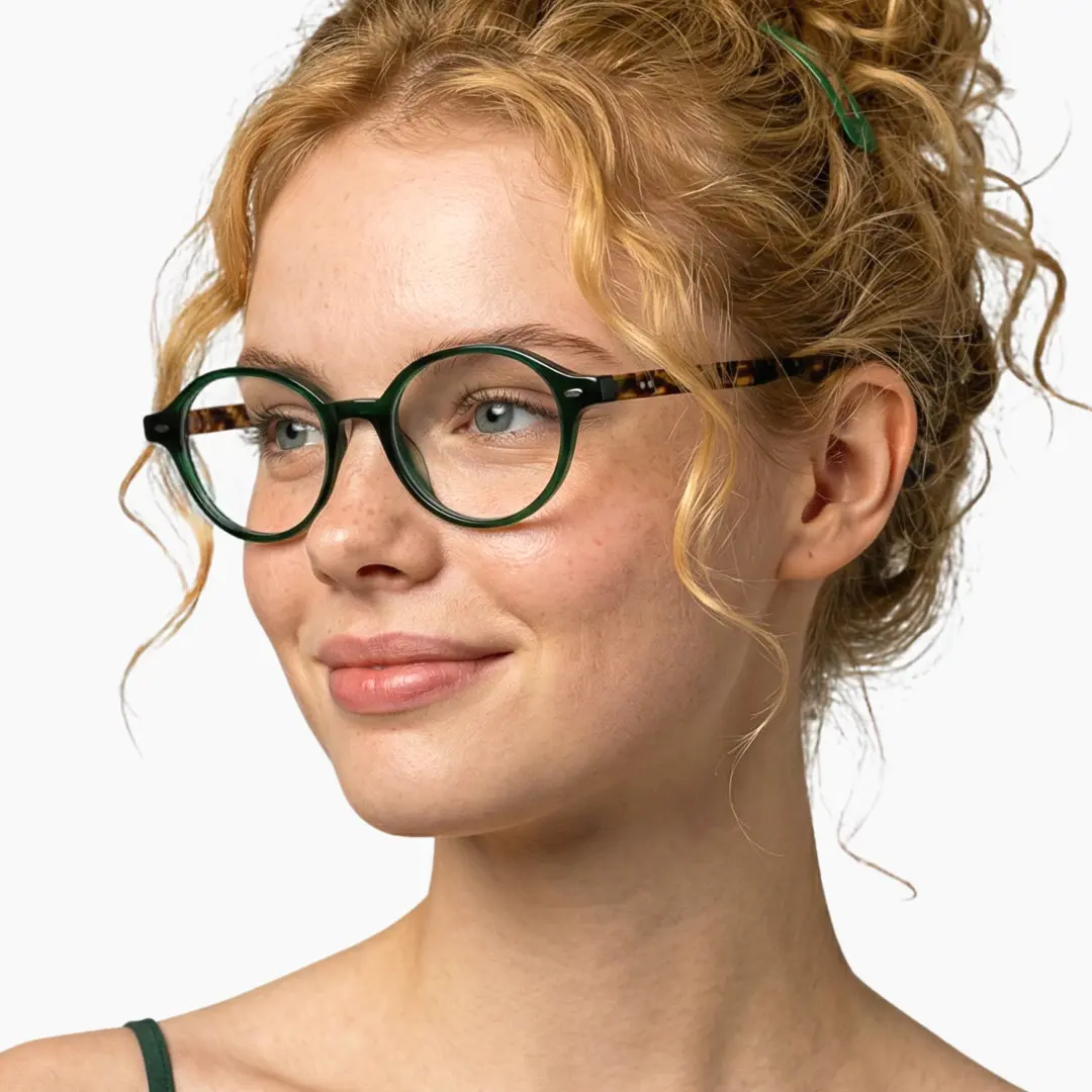 Three-quarter view of female wearing vintage green oval eyeglasses, friendly smile, OR0082406