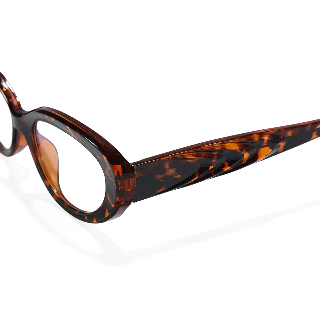 End piece detail of Ellie y2k oval tr90 eyeglasses in tortoise. SPU: OR0132510
