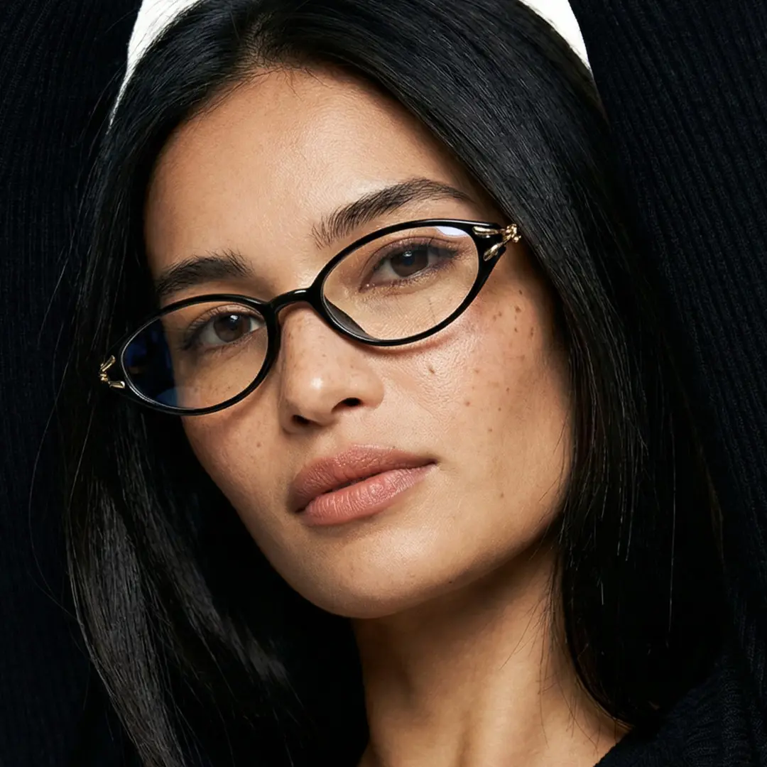 Front view of female wearing office siren black oval eyeglasses, calm expression, OR0152601