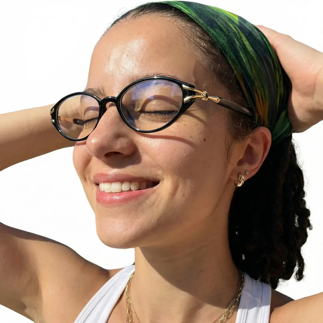 Slightly angled view of female wearing office siren black oval eyeglasses, soft smile, OR0152601