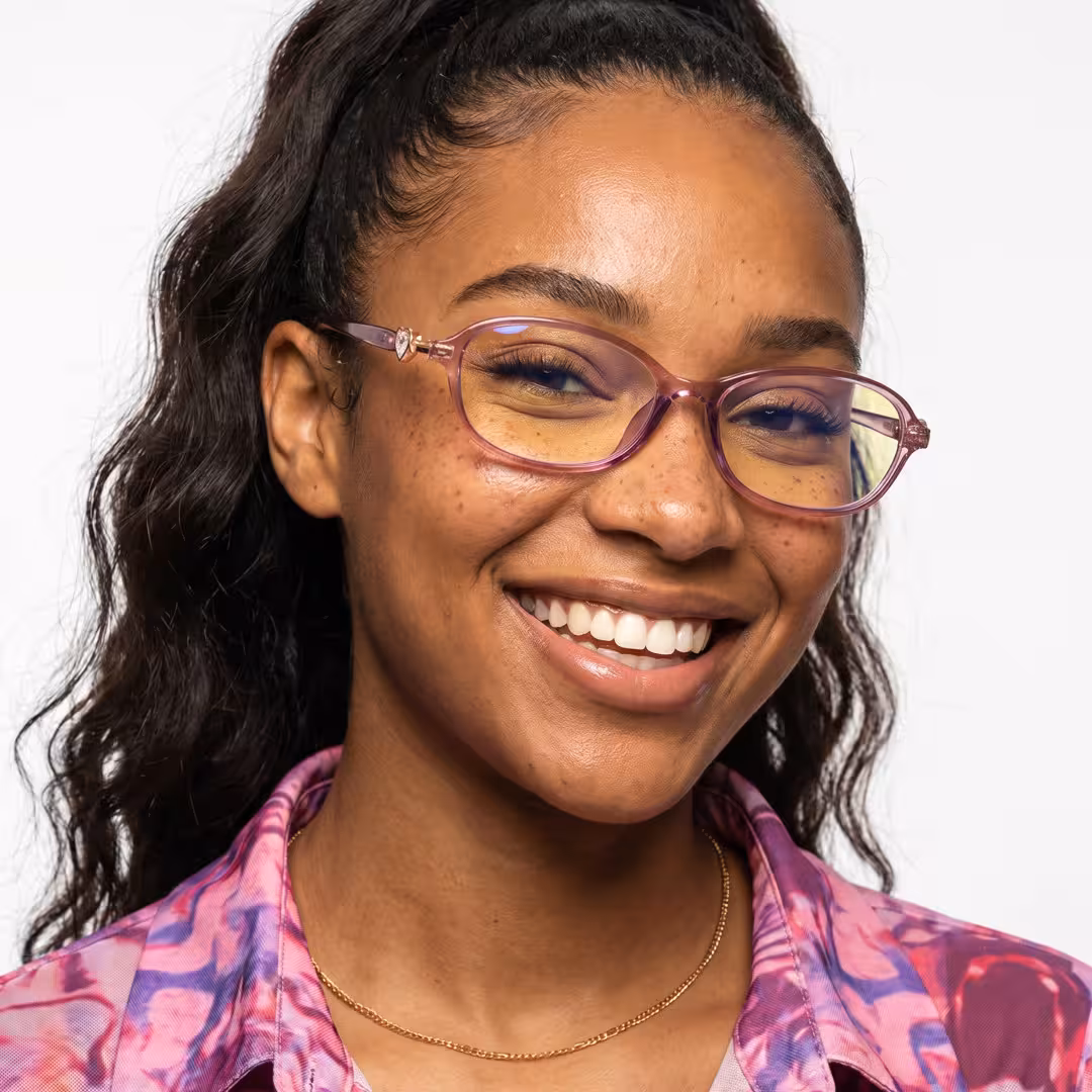 Front view of female wearing y2k pink oval eyeglasses, natural smile, OR0212411