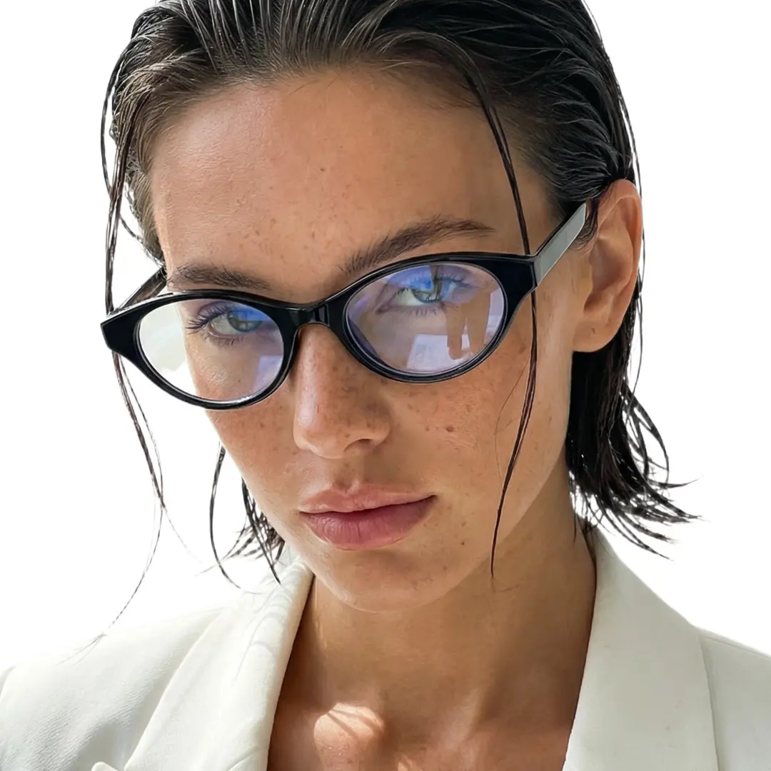 Portrait view of female wearing y2k black oval eyeglasses, neutral expression, OR0272512