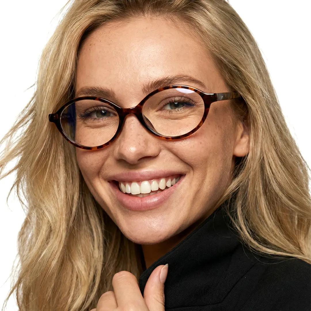 Front view of female wearing tortoise oval eyeglasses, smiling, OR0312402