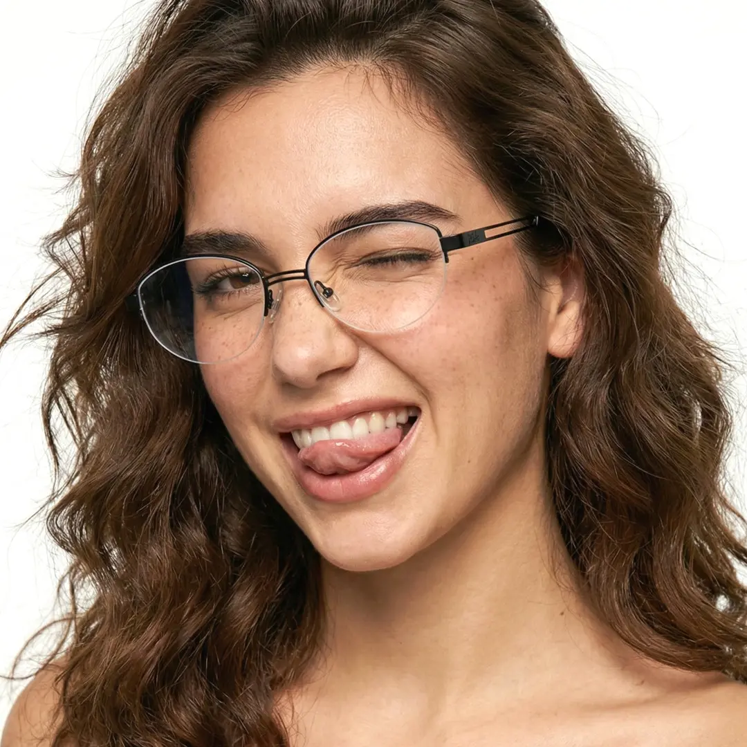 Slightly angled view of female wearing y2k black oval eyeglasses, sticking out tongue, soft smile, OT0022501