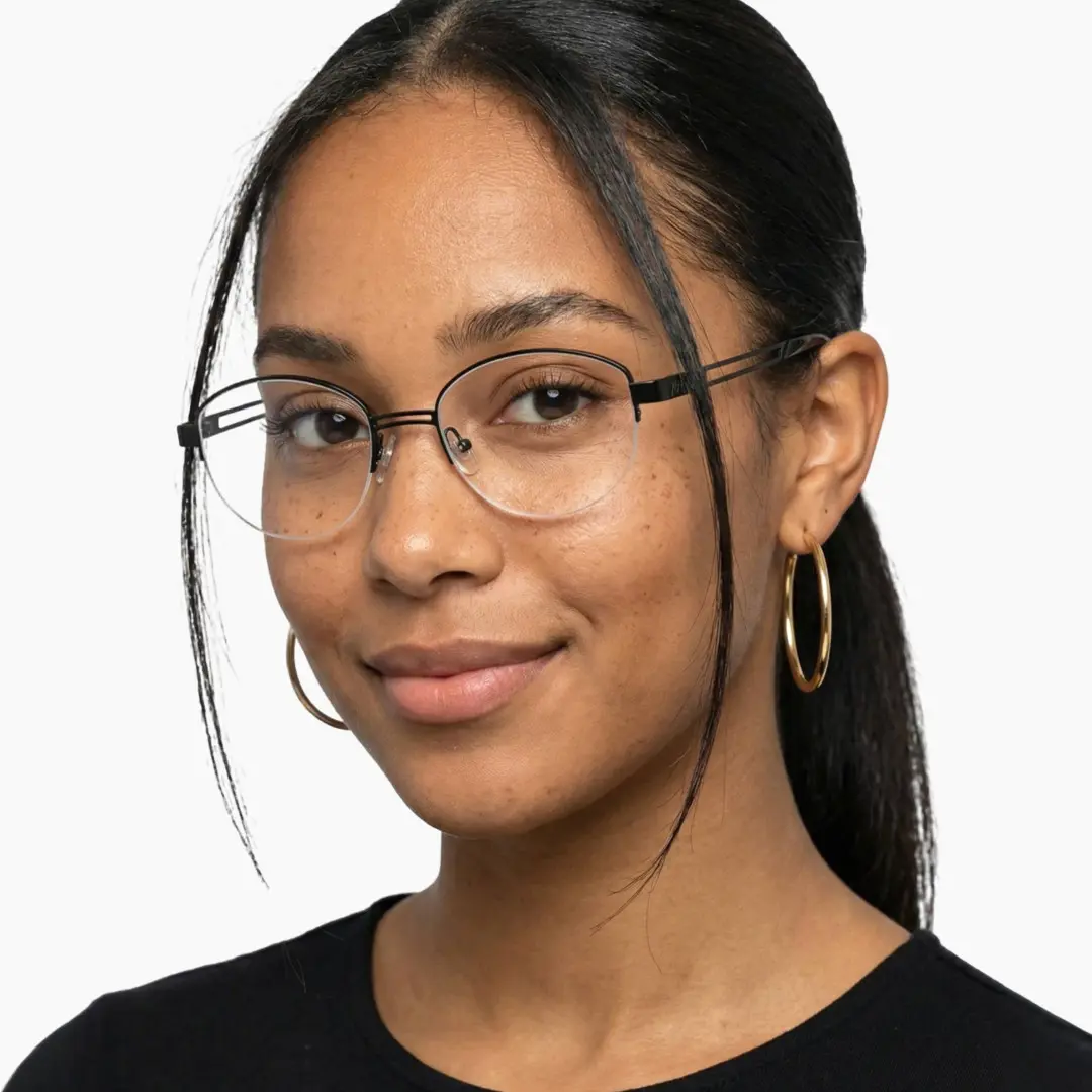 Three-quarter view of female wearing y2k black oval eyeglasses, natural smile, OT0022501