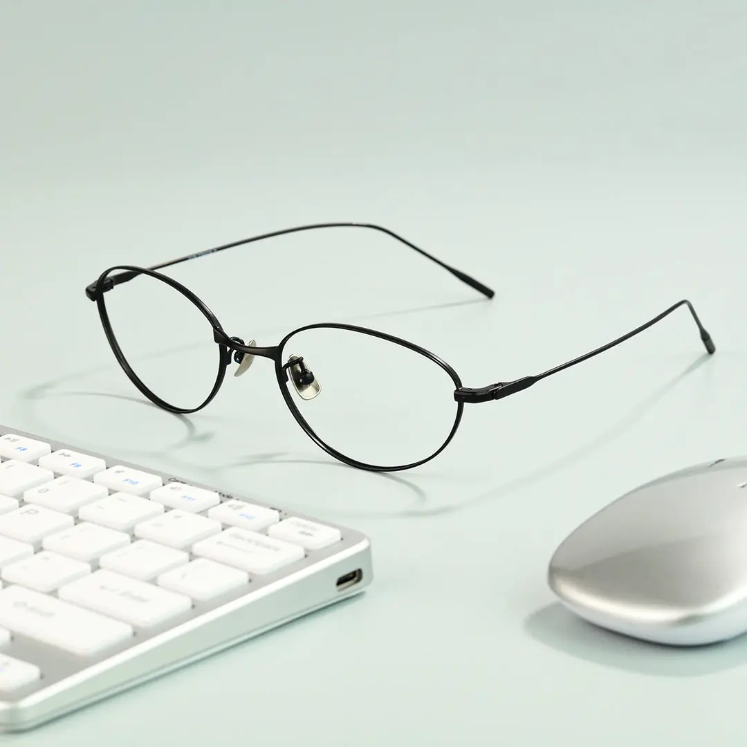 Scene view of Value y2k oval titanium eyeglasses OT0072501 in black
