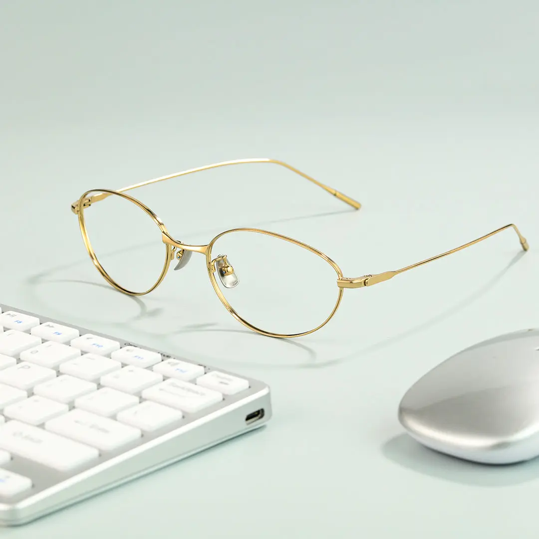 Scene view of Value y2k oval titanium eyeglasses OT0072501 in gold