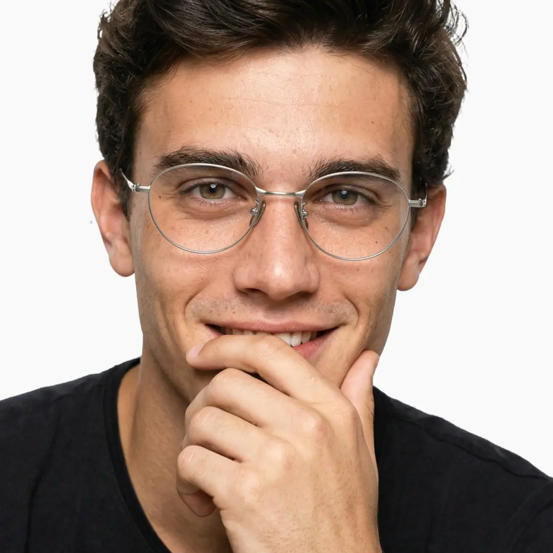 Front view of male wearing y2k silver oval eyeglasses, smiling, OT0072501