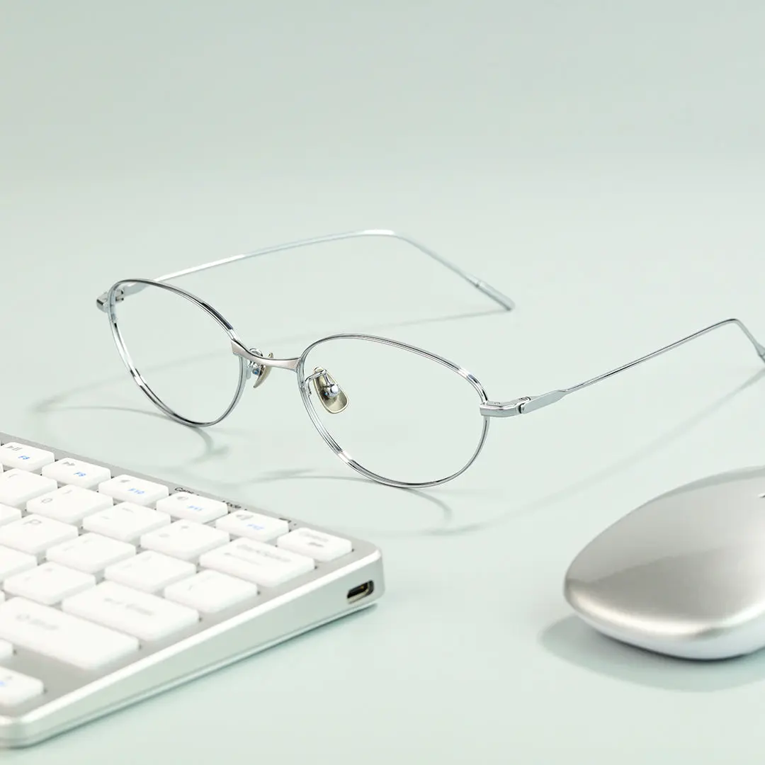 Scene view of Value y2k oval titanium eyeglasses OT0072501 in silver