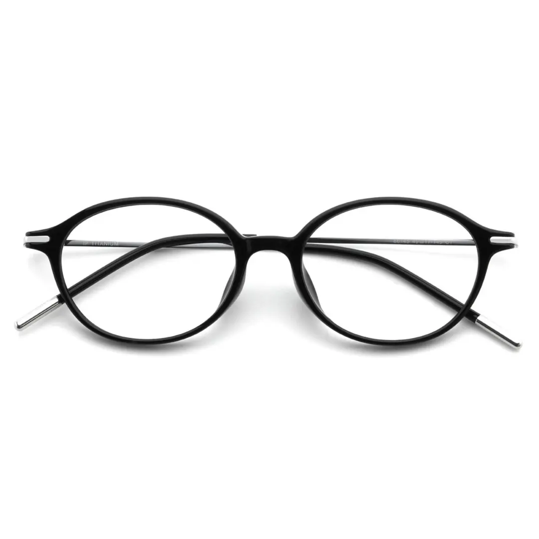 Front folded view of Skip y2k oval titanium eyeglasses OT0102412 in black