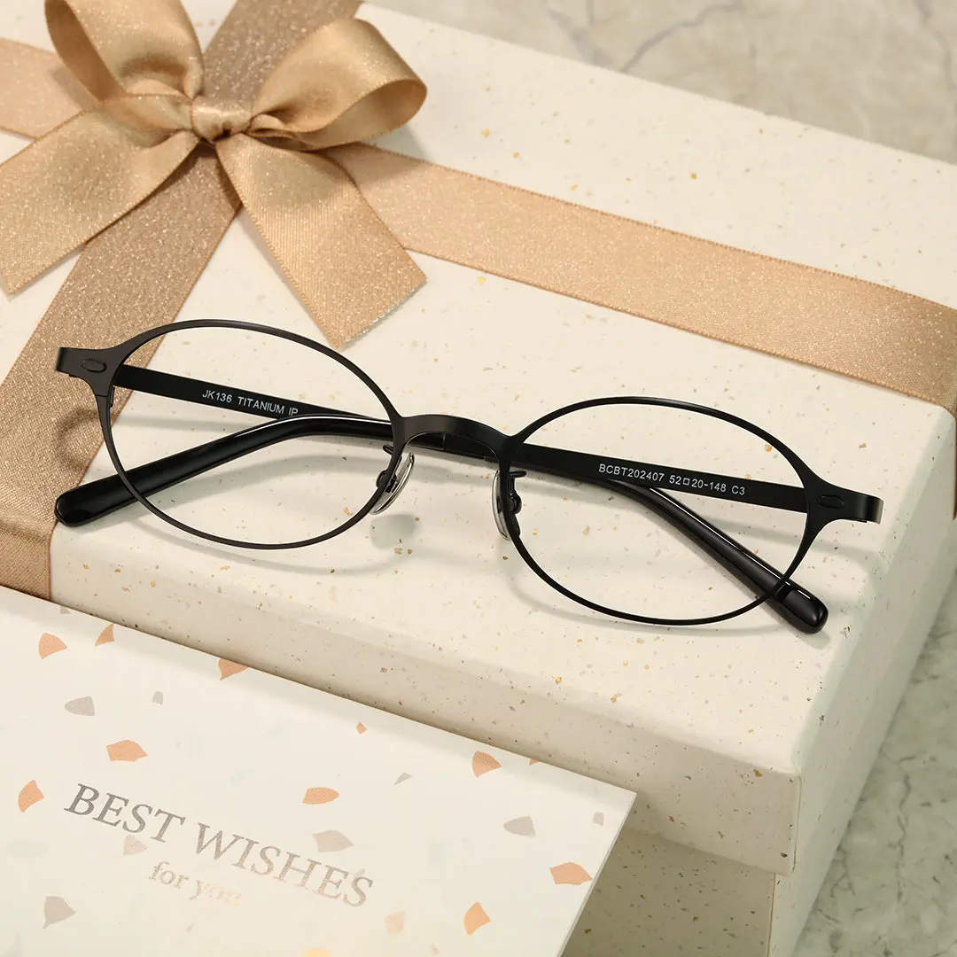Scene view of Tompkin oval titanium eyeglasses OT0132412 in black
