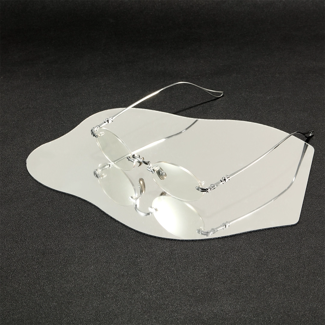 Scene view of Zuri oval titanium eyeglasses OT0142604 in silver