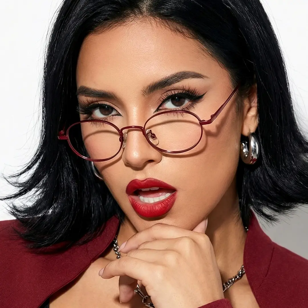 Front view of female wearing red oval eyeglasses, open mouth, OT0282502