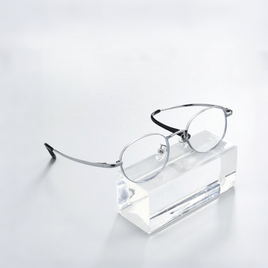 Scene view of Astr y2k oval titanium eyeglasses OT0282502 in silver