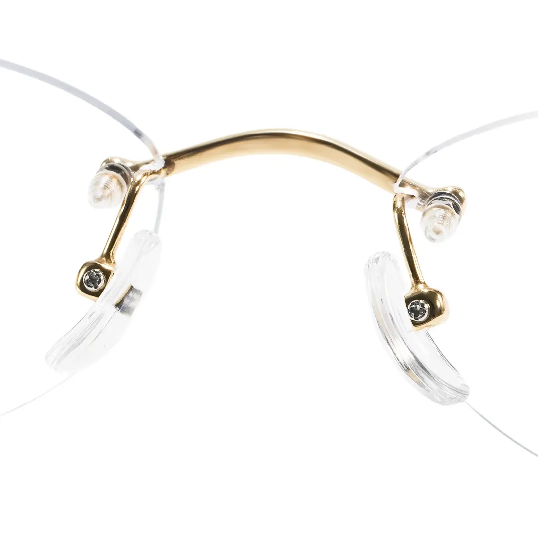 Adjustable nose pad detail of Mirelle fashion oval titanium eyeglasses in gold. SPU: OT0312604