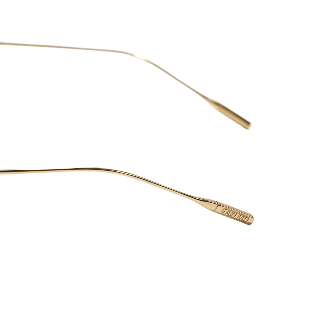 Temple detail of Mirelle fashion oval titanium eyeglasses in gold. SPU: OT0312604