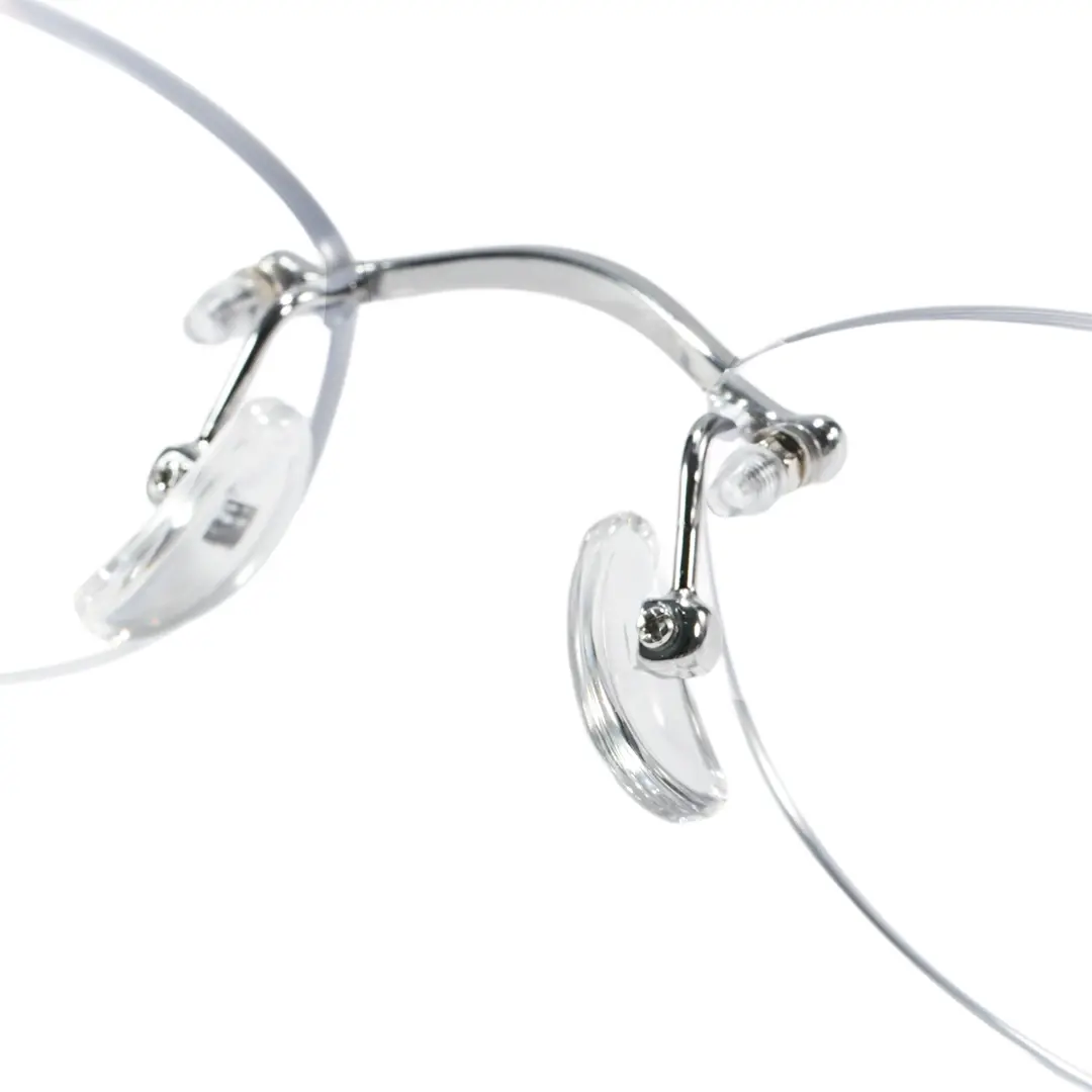 Adjustable nose pad detail of Mirelle fashion oval titanium eyeglasses in silver. SPU: OT0312604