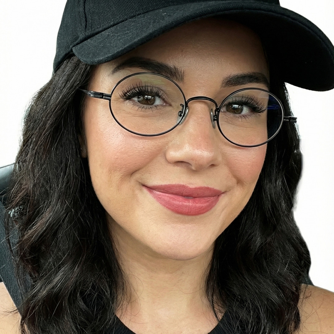 Three-quarter view of female wearing black oval eyeglasses, neutral expression, OT0402412