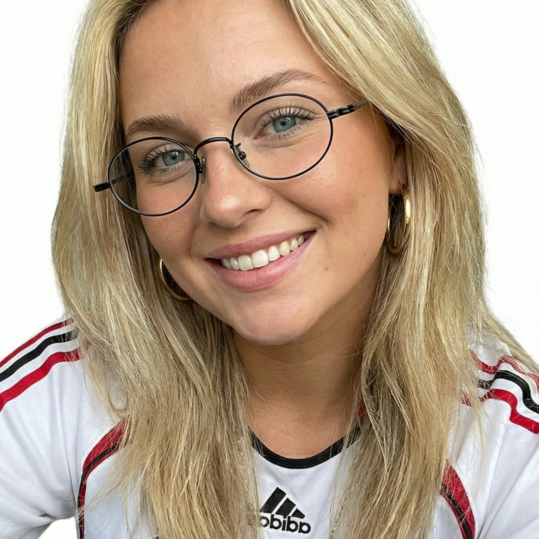 Front view of female wearing y2k black oval eyeglasses, tilting head, smiling, OT0402412