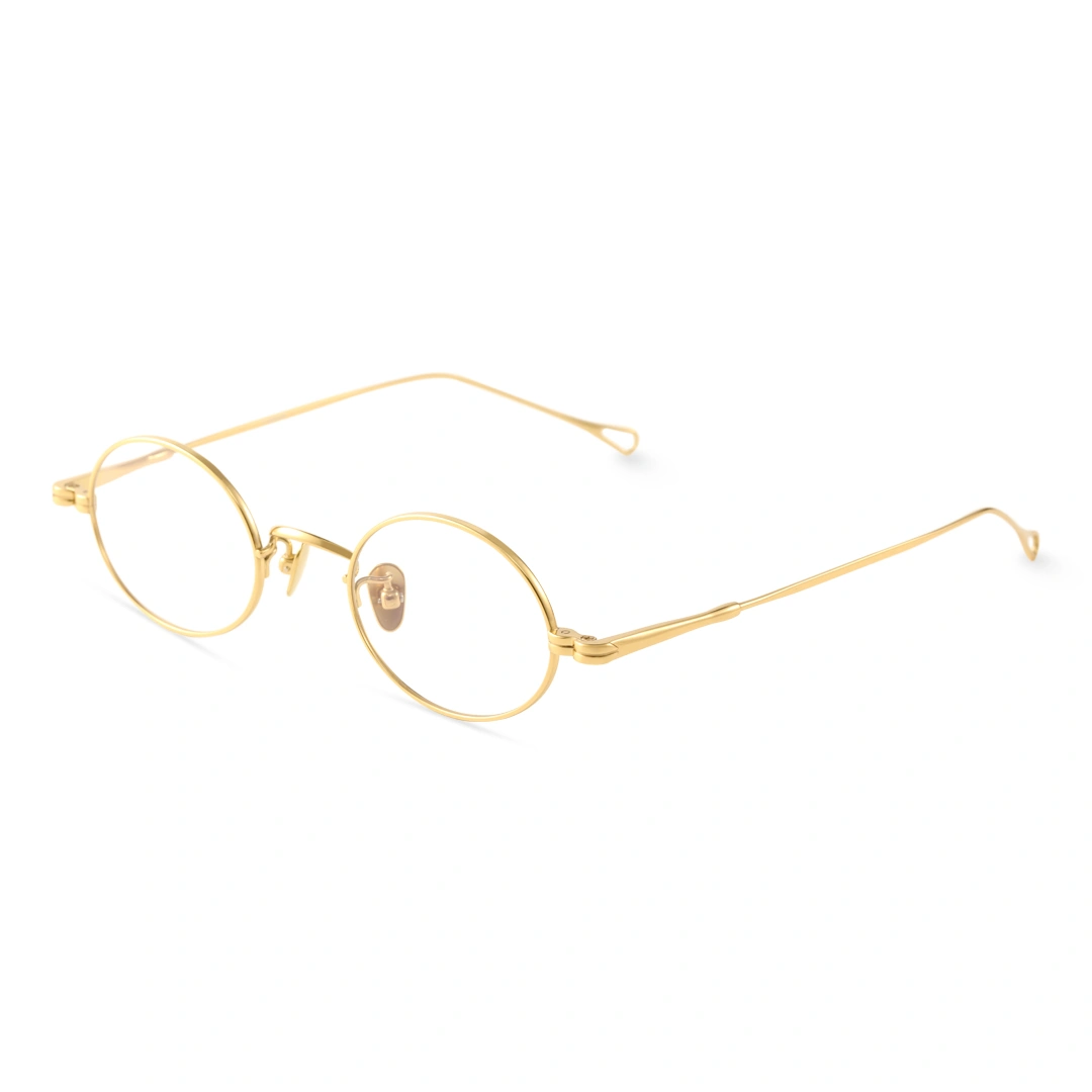 Angle view of Gannon y2k oval titanium eyeglasses OT0402412 in gold