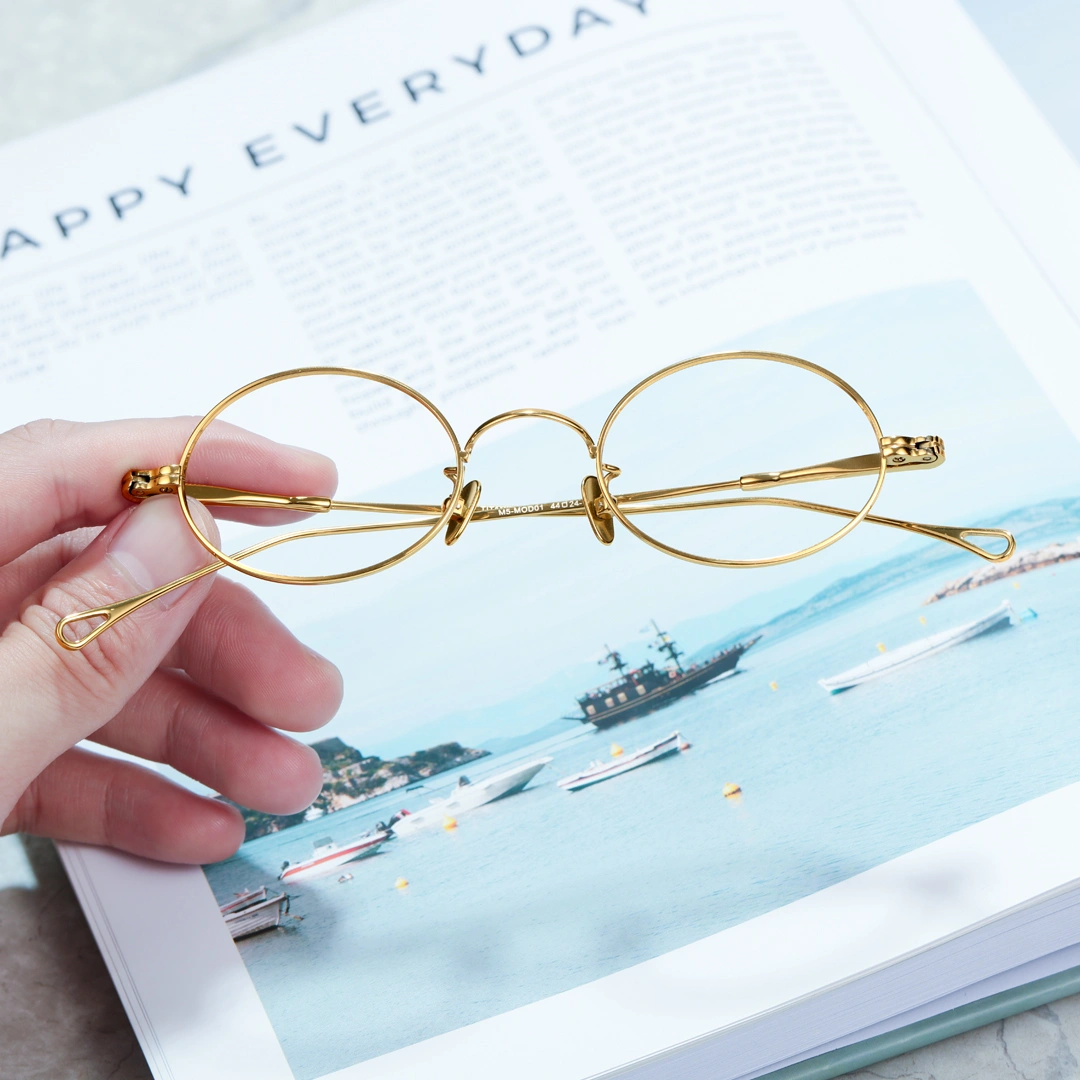 Scene view of Gannon y2k oval titanium eyeglasses OT0402412 in gold