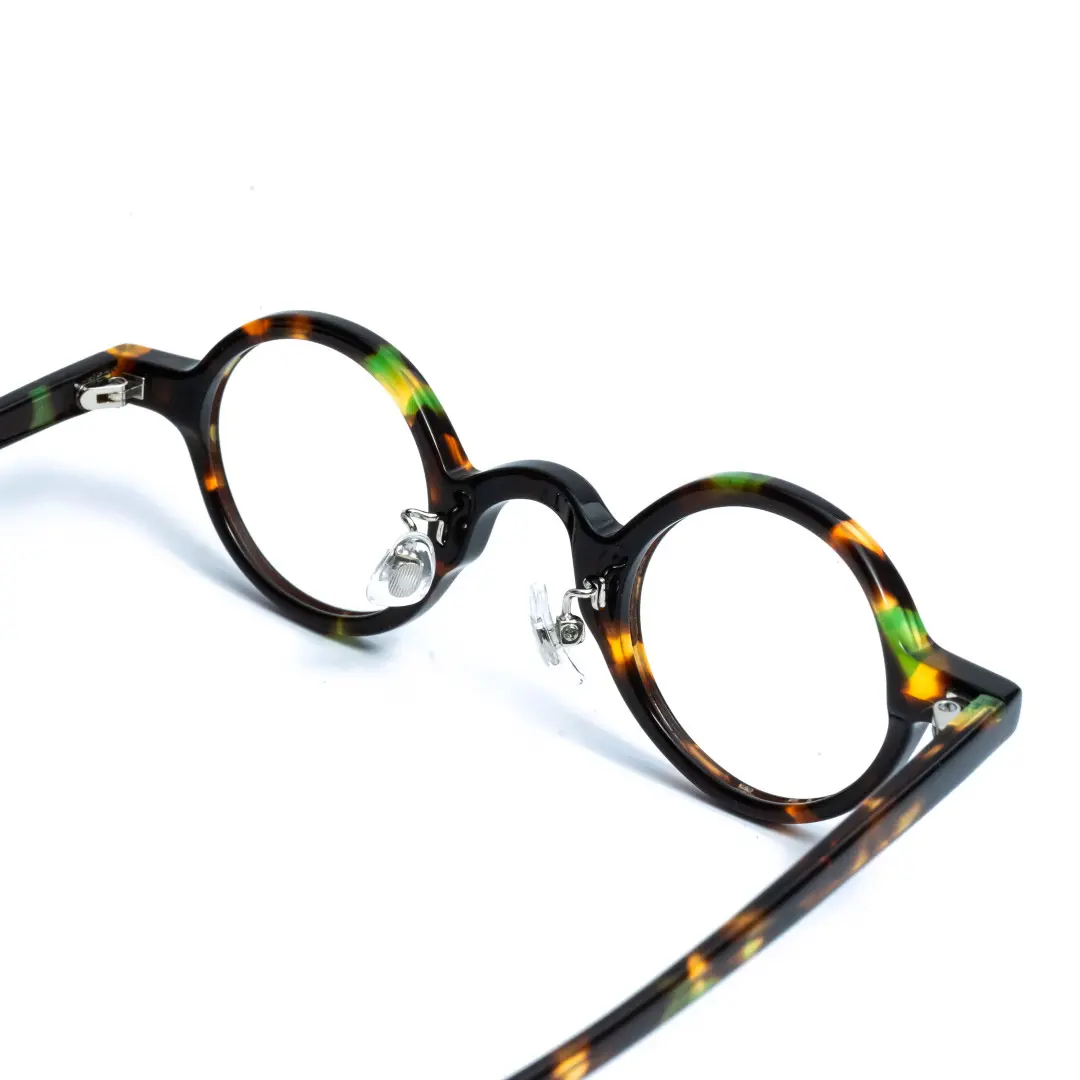 Adjustable nose pad detail of Lala vintage round acetate eyeglasses in tortoise. SPU: RA0012306