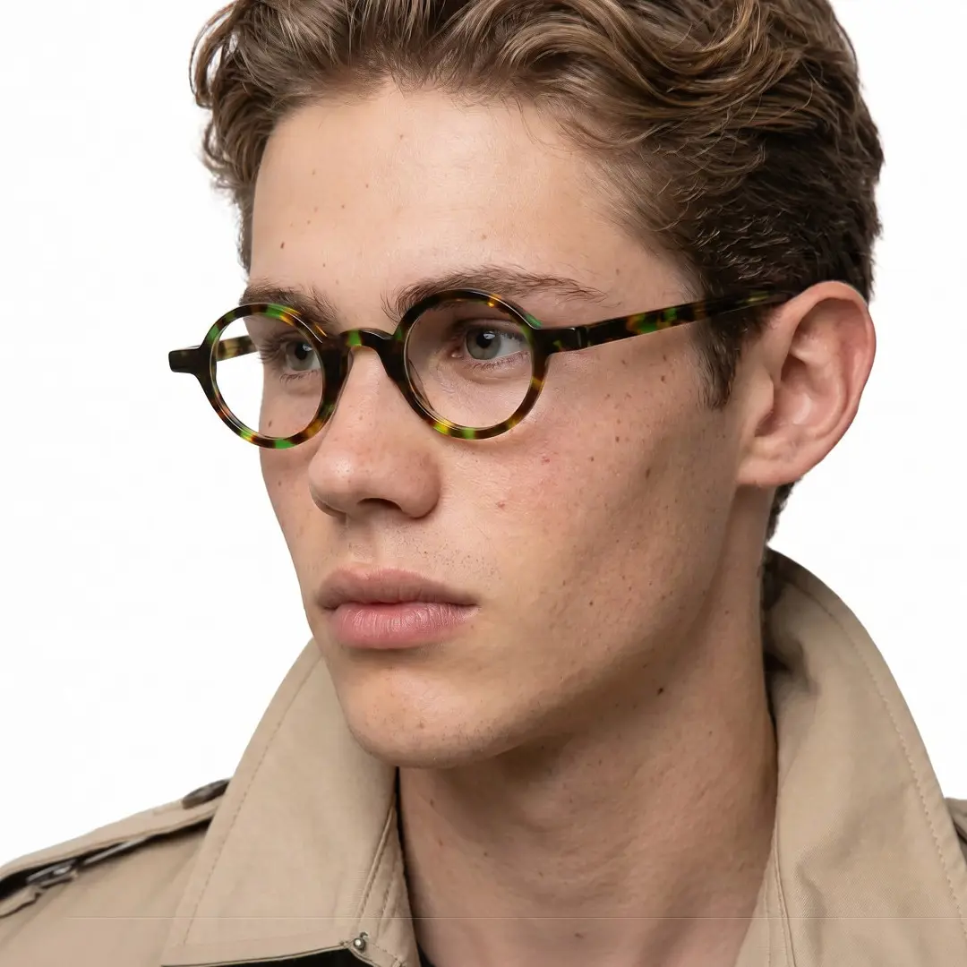 Profile view of male wearing vintage tortoise round eyeglasses, neutral expression, RA0012306
