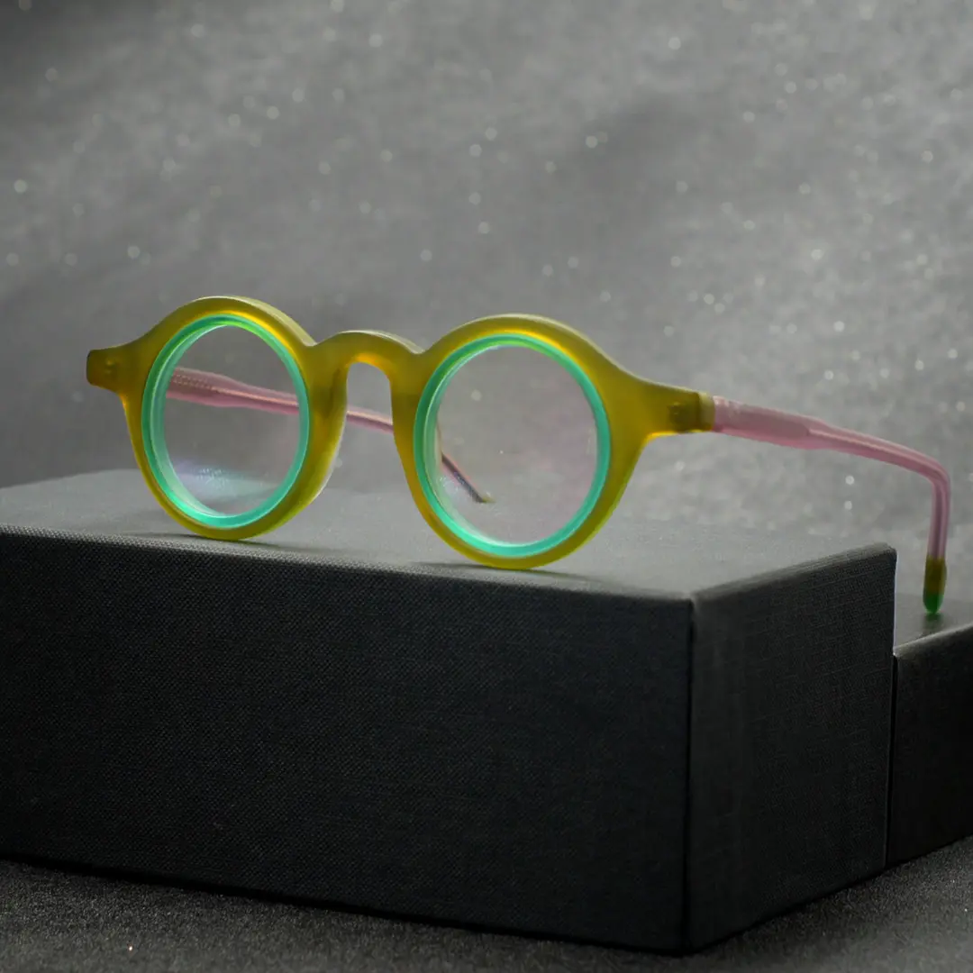 Scene close-up view of Fate vintage round acetate eyeglasses RA0012311 in army green