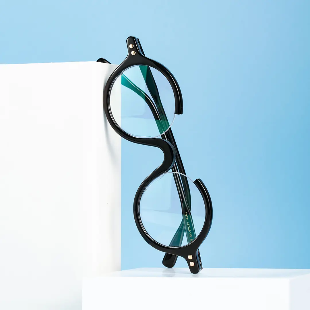 Scene close-up view of Paola round acetate eyeglasses RA0022212 in black