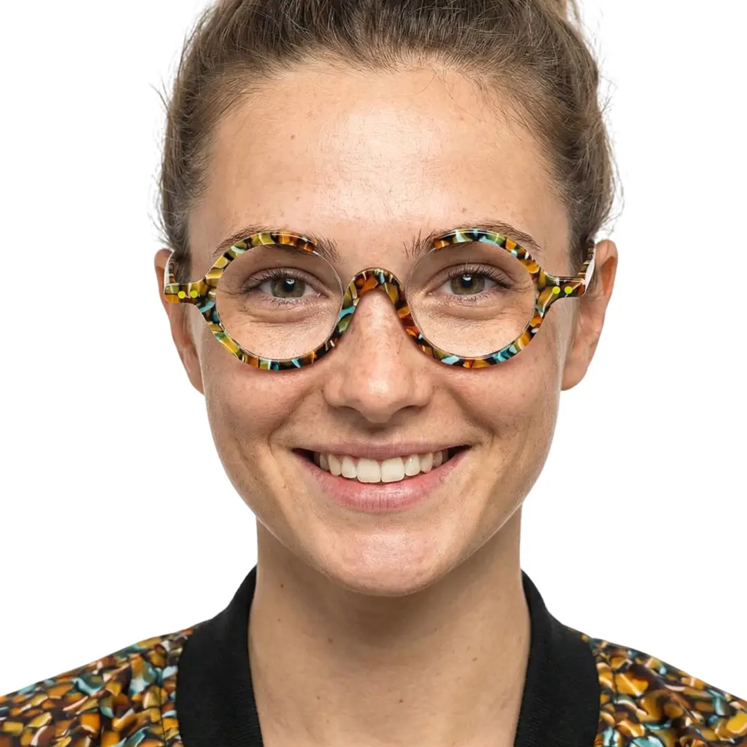 Front view of female wearing multicolor round eyeglasses, smiling, RA0022212
