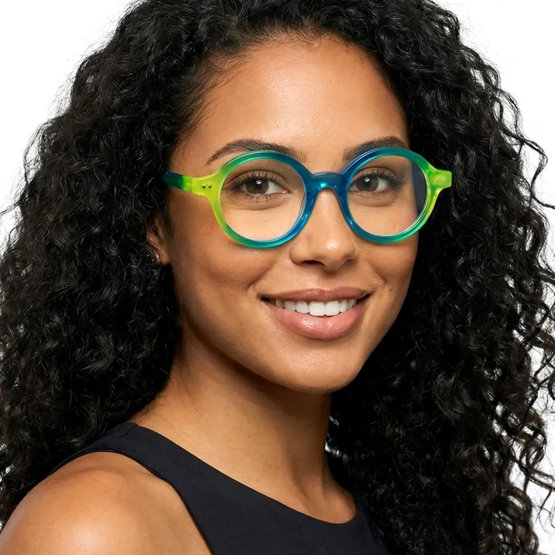Front view of female wearing blue round eyeglasses, friendly smile, RA0022307