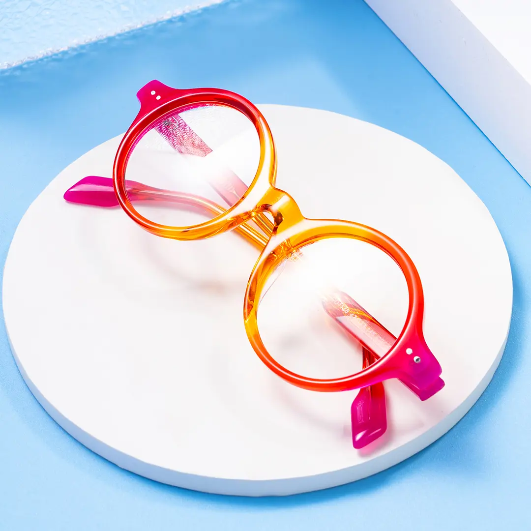 Scene close-up view of Luv colorful round acetate eyeglasses in orange. SPU: RA0022307