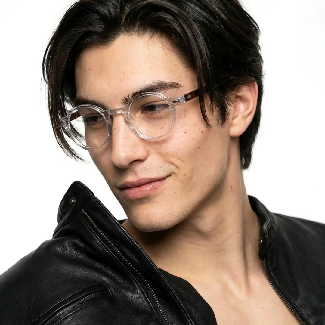 Profile view of male wearing vintage clear round eyeglasses, natural smile, RA0042301