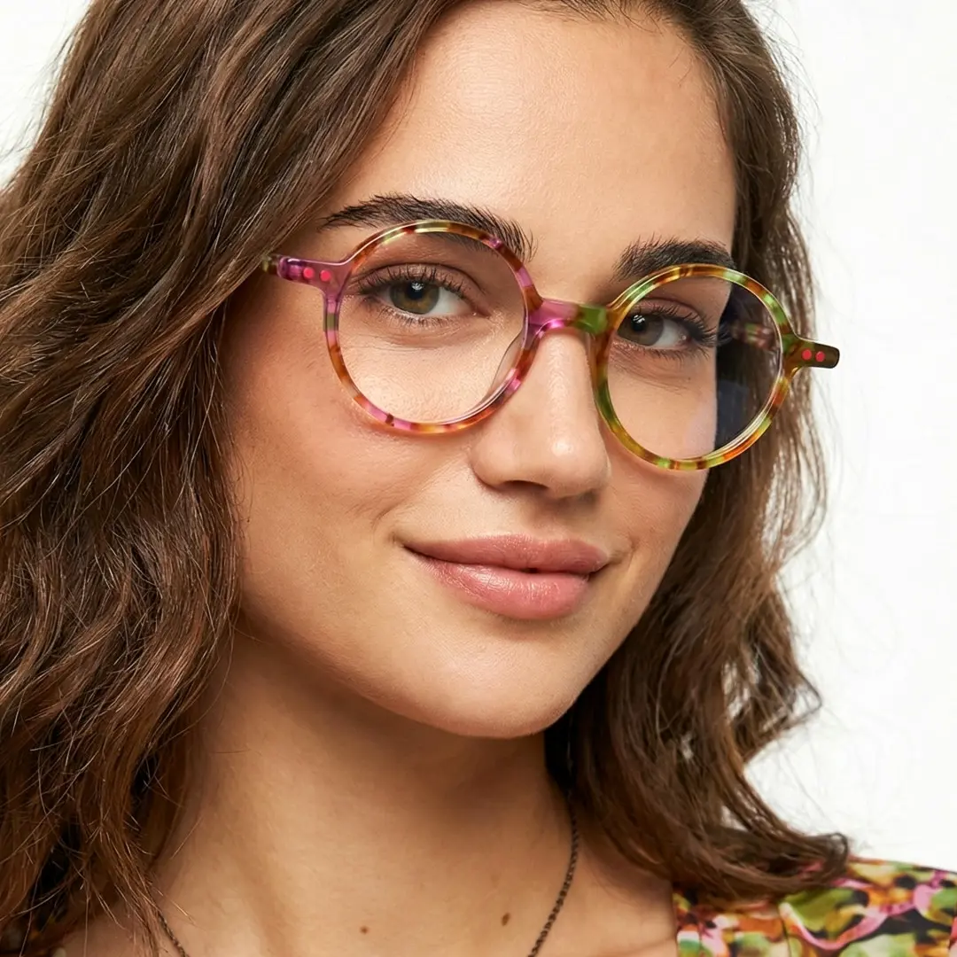 Front view of female wearing colorful multicolor round eyeglasses, soft smile, RA0052207