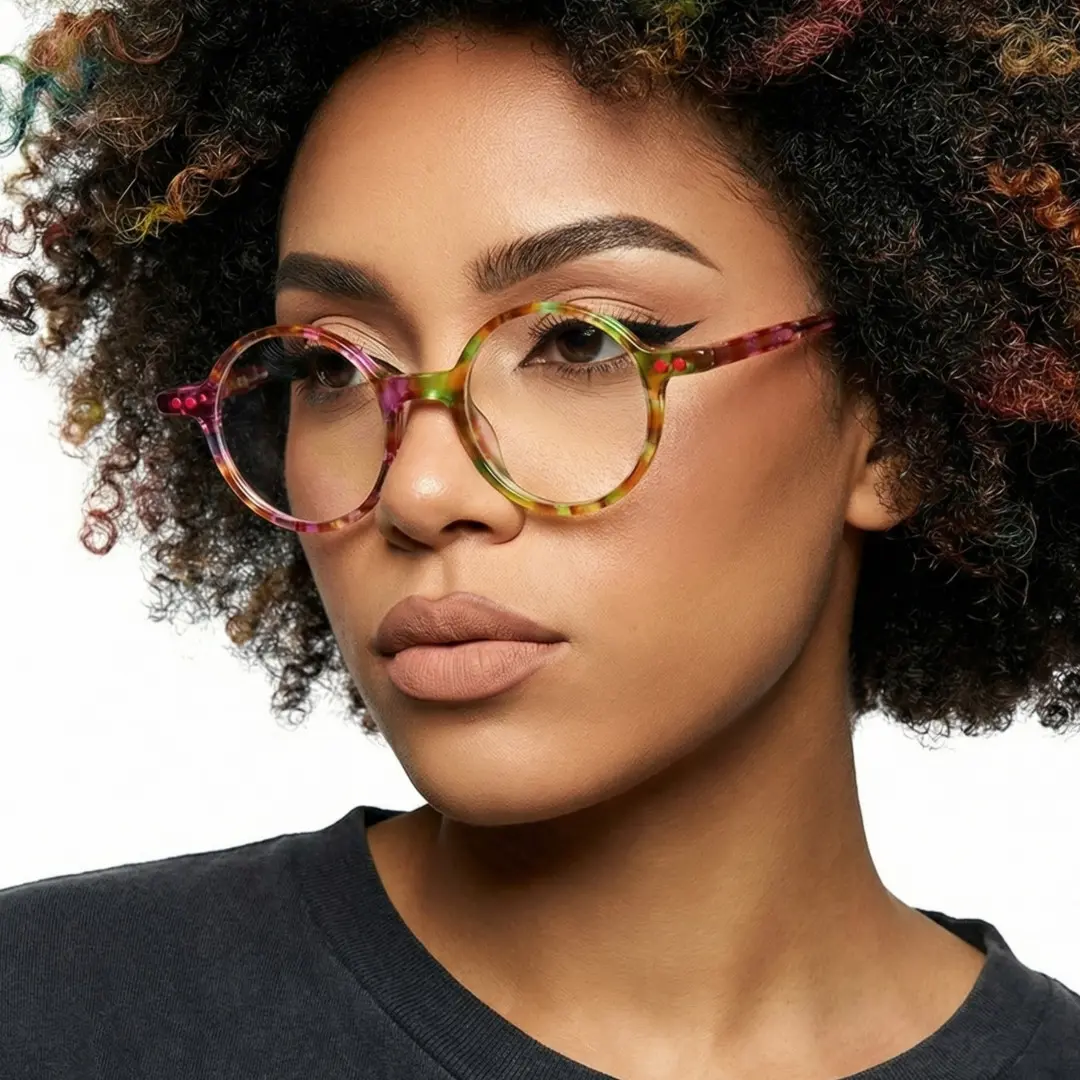 Three-quarter view of female wearing colorful multicolor round eyeglasses, calm expression, RA0052207