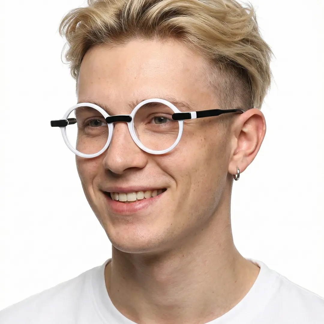 Three-quarter view of male wearing black round eyeglasses, smiling, RA0052305