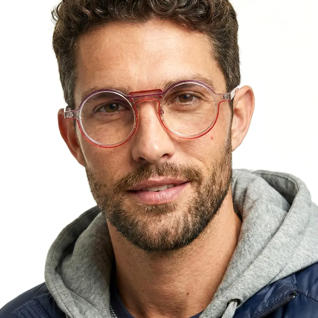 Front view of male wearing steampunk red round eyeglasses, natural smile, RA0052306
