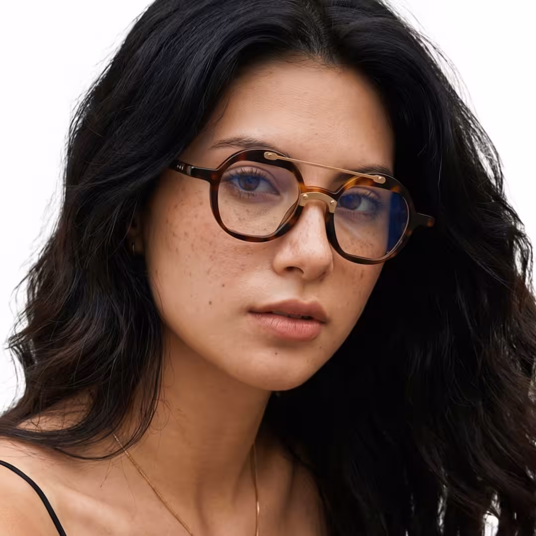 Female wearing vintage tortoise round acetate eyeglasses, breathing naturally while looking at camera. SPU: RA0052308