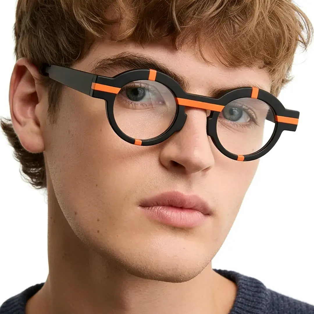 Front view of male wearing black round eyeglasses, calm expression, RA0062311
