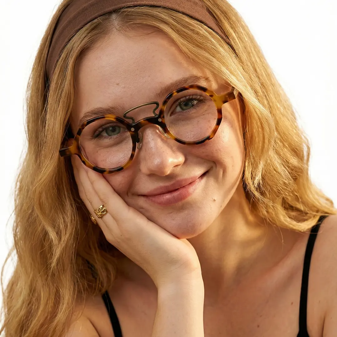 Female wearing vintage tortoise round acetate eyeglasses, friendly smile while hand near face. SPU: RA0092305