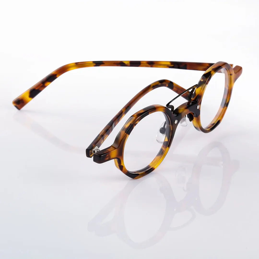 Scene close-up view of Kishi vintage round acetate eyeglasses in tortoise. SPU: RA0092305