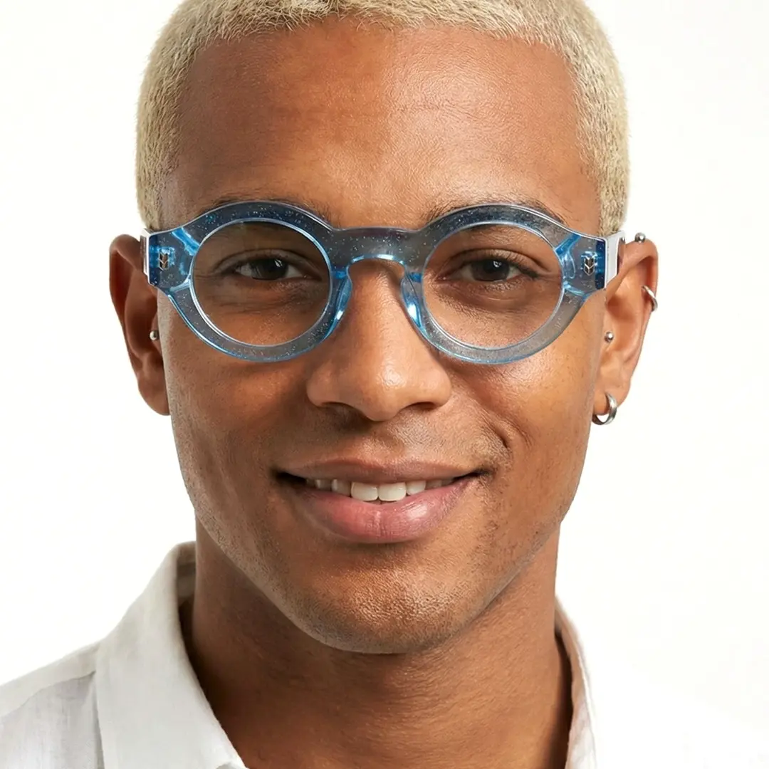 Front view of male wearing blue round eyeglasses, natural smile, RA0110507