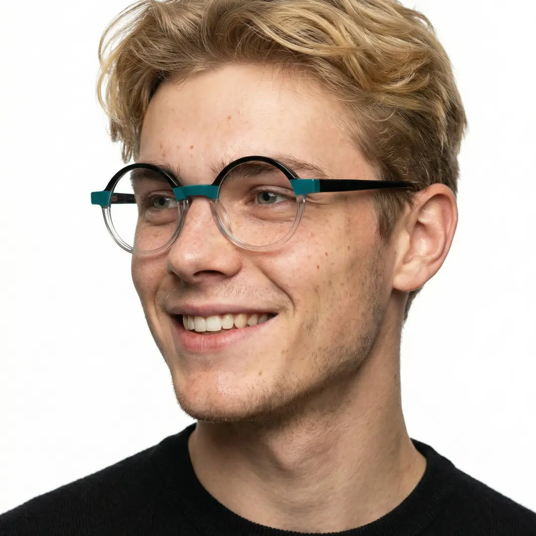 Three-quarter view of male wearing two-tone round eyeglasses, smiling, RA0112309