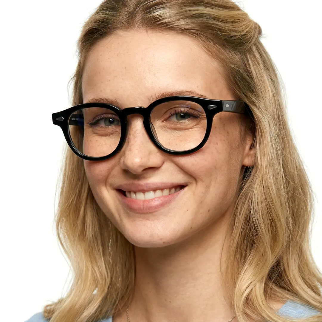 Front view of female wearing vintage black round eyeglasses, friendly smile, RA0152411
