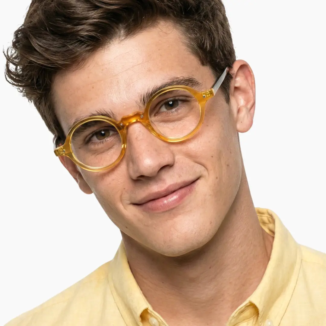 Male wearing vintage yellow round acetate eyeglasses, neutral expression while tilting head. SPU: RA0182302